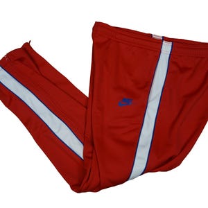 red and white nike joggers