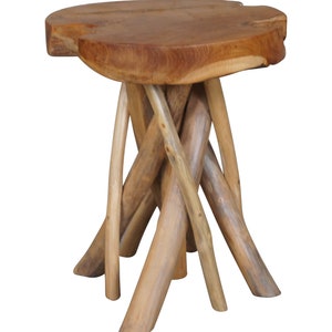 May include: A natural wood side table with a round top and a unique, woven base made of branches. The table is made of light brown wood and has a rustic, organic look.
