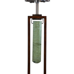May include: A table lamp with a green marble base and a brown wooden frame. The lamp has a chrome finish and a white shade.