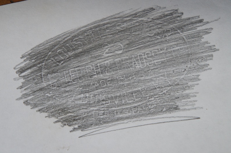 May include: A close-up of a gray, textured, rectangular surface with the word "remarkable" printed in white.