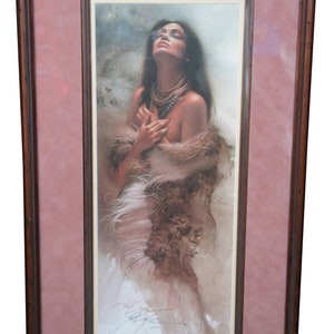 May include: A framed print of a woman with long dark hair wearing a fur shawl. She is looking up and has a necklace on. The print is signed by the artist.