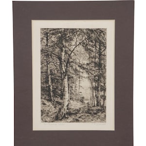May include: Black and white forest landscape print, framed in a brown mat. The artwork depicts a detailed view of trees and foliage, with light filtering through the canopy. The print is mounted on a white background.