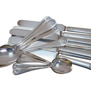 May include: A set of three ceramic mugs with a speckled, matte finish. The mugs are in shades of cream, light gray, and dark gray. Each mug has a simple, minimalist design, perfect for coffee or tea.