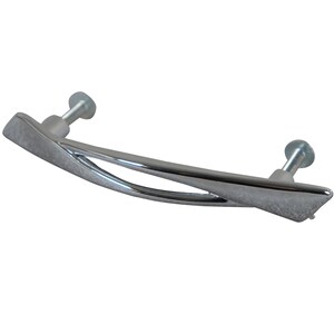 May include: A silver-toned cabinet pull with a curved, modern design. The pull has a textured finish and a cutout in the center.