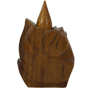 May include: A handcrafted wooden leaf-shaped sculpture with a natural brown finish. The sculpture features carved details, including leaf veins and a central pointed element. This decorative piece is ideal for home decor.