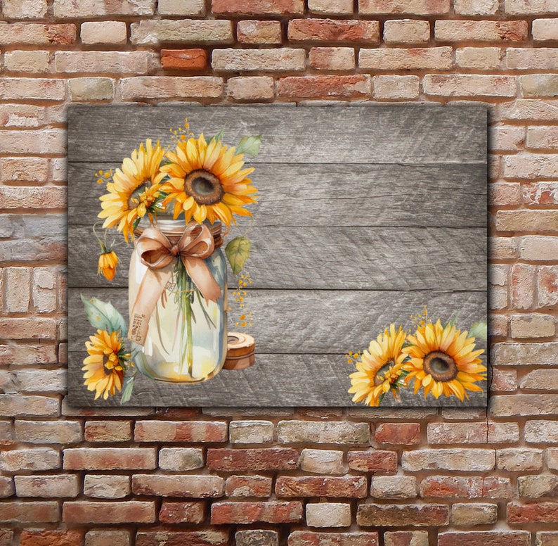May include: A watercolour painting of sunflowers in a mason jar with a brown ribbon tied around the jar. The jar is sitting on a grey wooden background.