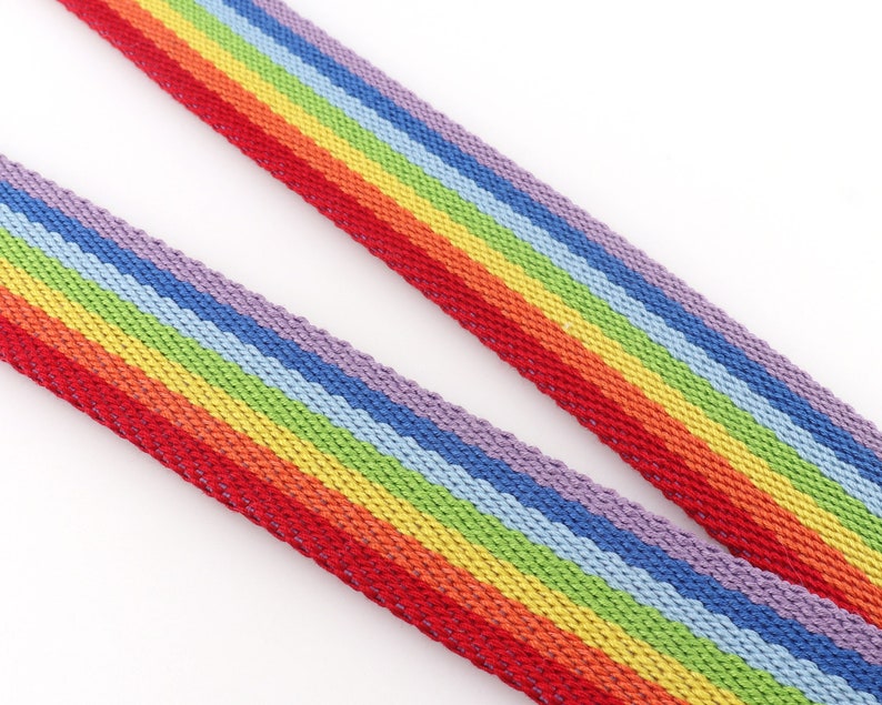 May include: Rainbow striped webbing with red, orange, yellow, green, blue, indigo, and violet stripes.