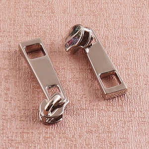 10pcs Silver Pulls for #3 Nylon Coil Zippers Silver Zipper Sliders Bulk Repair Kit Replacement Sewing Bag Jackets Purses Bags DIY Garment