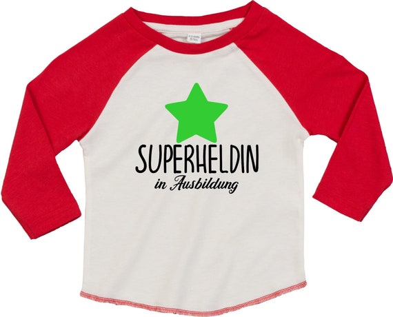 Kleckerliese Baby Kinder T-Shirt Langarmshirt  "Superheldin in Ausbildung" Raglan-Ärmel Jungen Mädchen