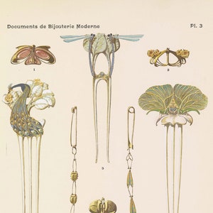 May include: A collection of 10 gold jewelry pieces, including brooches, hair combs, and a bracelet. The jewelry features intricate designs with floral motifs, butterflies, and peacocks. The pieces are adorned with gemstones, including topazes, rubies, and sapphires.