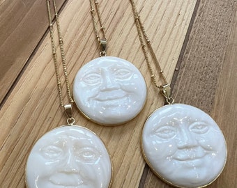 Man in the moon gold plated shell necklace