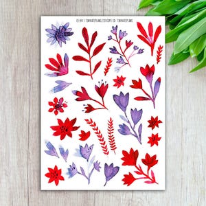 May include: A sheet of watercolor floral stickers featuring red and purple flowers and leaves. The stickers have a delicate, hand-painted appearance, with varying shapes and sizes. The text "ES-148 | TINYKATEPLANS.ETSY.COM | IG: TINYKATEPLANS" is printed at the top.