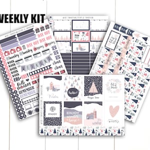 May include: A weekly planner kit with winter-themed stickers. The stickers feature a variety of designs, including snowflakes, trees, and houses. The stickers are in shades of pink, blue, and gray. The text on the stickers includes "Let it snow", "Winter", "Magic Time", "It's Winter", and "Enjoy Winter Time".
