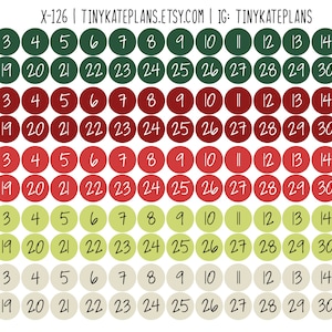 May include: Four rows of calendar stickers with numbers 1 through 31 in white text on different colored circles. The first row is green, the second row is red, the third row is pink, and the fourth row is beige.