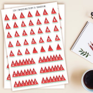May include: A sheet of watermelon-themed stickers with numbers 1-31 and the word "weekend" repeated multiple times. The stickers are printed on white paper and have a glossy finish.