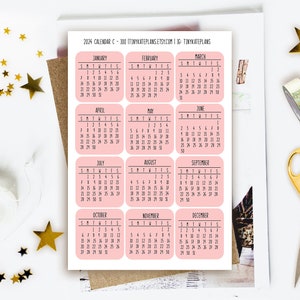 May include: A sheet of 100 pink calendar stickers with black text. The stickers are for each month of the year 2024. The text on the sheet reads "2024 Calendar C - 100 ITINYKATEPLANS.ETSY.COM | TINYKATEPLANS".