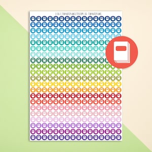 May include: A sheet of colorful round stickers with a white book icon in the center of each sticker. The stickers are arranged in rows of 10, with each row featuring a different color. The colors include blue, green, yellow, orange, red, pink, purple, and dark blue.