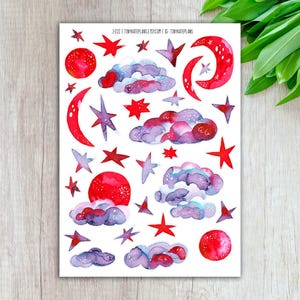 May include: A sheet of watercolor stickers featuring celestial elements. The design includes red moons, stars, and clouds in shades of purple and blue. The text "J-222" and the Etsy shop name are visible at the top. The stickers are arranged on a white background.