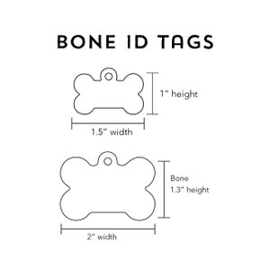 May include: Two bone-shaped dog ID tags, one measuring 1.5 inches wide by 1 inch high, and the other measuring 2 inches wide by 1.3 inches high.