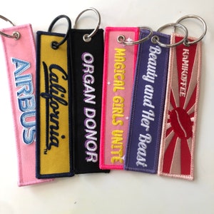 Luchtvaartsleutelhangers, sleutelhanger van stof op maat, motorsleutelhanger, promotiesleutelhanger, gepersonaliseerde sleutelhangers, geborduurd sleutelhanger