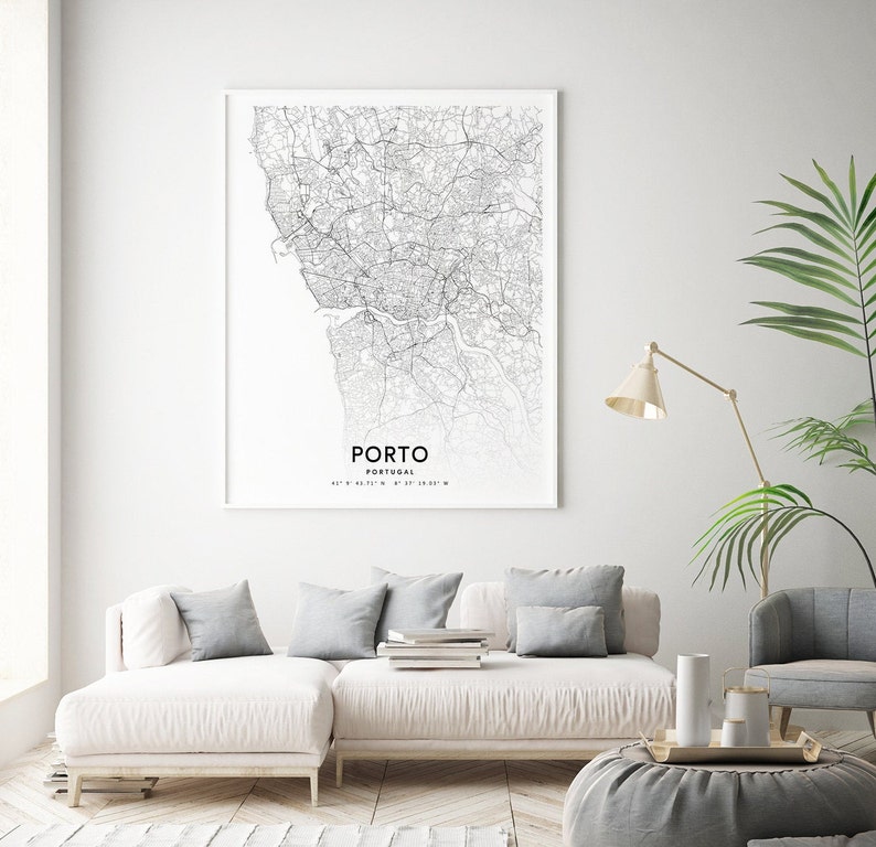 May include: A black and white line art map print of Porto, Portugal. The map shows the city streets and waterways. The text "PORTO" and "PORTUGAL" are printed below the map, along with the coordinates 41&deg; 09' 43.17" N 8&deg; 37' 38.05" W.