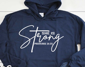 May include: Navy blue hooded sweatshirt with white text that reads "She is Strong Proverbs 31:25".