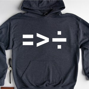 May include: A dark gray hooded sweatshirt with a white graphic of the mathematical symbols "equals", "greater than", and "divided by".