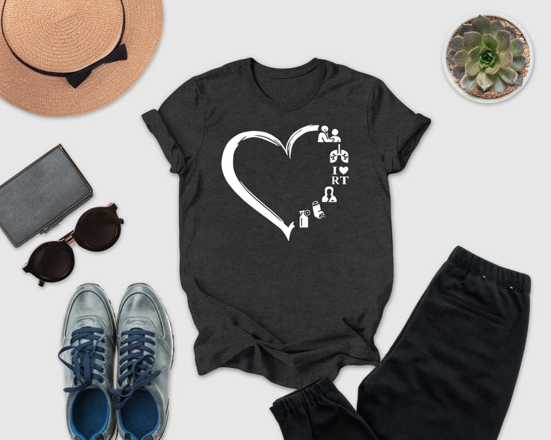 a casual outfit consisting of a black t-shirt with a white heart design, a pair of gray sneakers, a hat, sunglasses, a wallet, a potted succulent, and a pair of black pants.