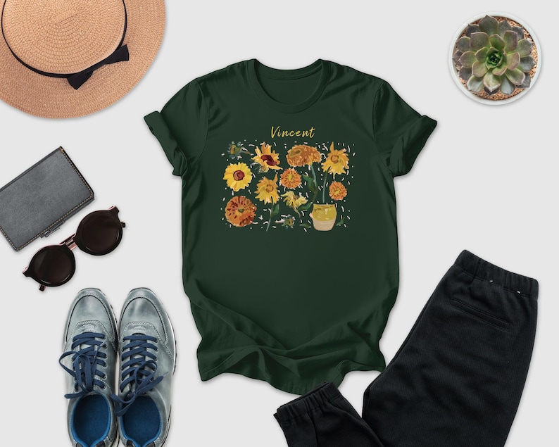a collection of various items, including a green t-shirt with a floral design, sunglasses, a hat, a wallet, a pair of sneakers, and a pair of pants.