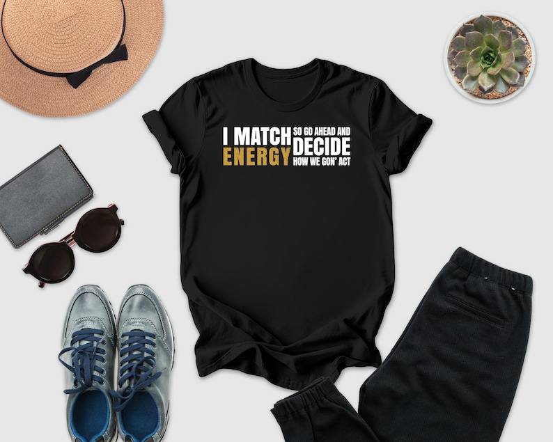 a casual outfit consisting of a black t-shirt with a humorous text, a pair of sunglasses, a hat, a wallet, a pair of sneakers, and a potted plant.