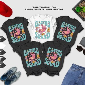 a collection of clothing items, including T-shirts, jeans, and accessories, arranged on a white background.