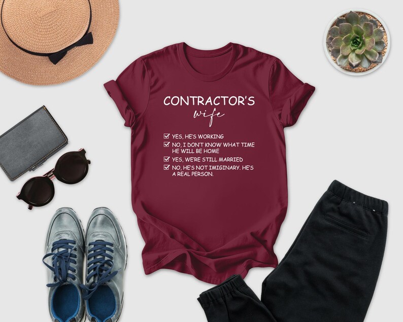 a variety of items, including a red t-shirt with a humorous text, sunglasses, a hat, a wallet, a potted plant, and a pair of pants, all arranged on a white background.