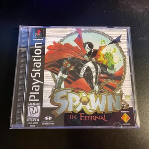May include: A PlayStation game case for Spawn: The Eternal. The case is silver with a black and red image of Spawn, a comic book character, on the front. The game is rated M for Mature by the ESRB.