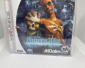 May include: A Sega Dreamcast game case for Shadow Man, a mature rated game by Acclaim.
