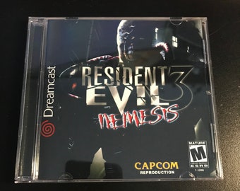 May include: A Dreamcast game case for Resident Evil 3: Nemesis. The case is black with a red and white logo. The game is rated M for Mature by the ESRB.