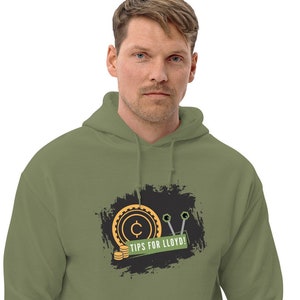 May include: A green hooded sweatshirt with a black and white graphic design featuring a coin with a "C" on it, two wrenches, and the text "Tips for Lloyd!"