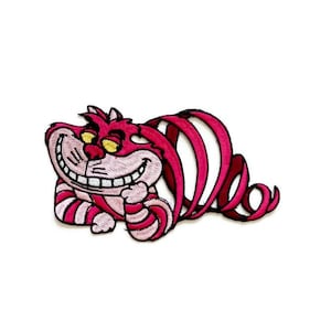 May include: An embroidered iron-on patch featuring the Cheshire Cat from Alice in Wonderland. The cat is pink and white with a wide grin and yellow eyes. It is curled up in a spiral shape.