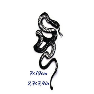 May include: Black and white snake tattoo design. The snake is curled up in a coil with its head raised. The tattoo is 2.7 x 7.4 inches.