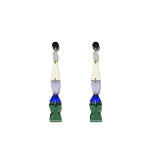 May include: A pair of long, dangling earrings with geometric shapes. The earrings are made of acrylic and feature a white, lavender, blue, and green colour scheme.
