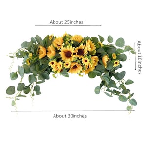 May include: A sunflower garland with eucalyptus greenery, measuring approximately 25 inches wide and 10 inches tall. The garland is perfect for adding a touch of summer to any space.