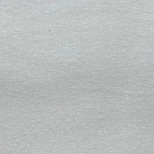 May include: A close-up of a light gray fabric with a subtle texture. The fabric has a smooth, even surface with a slightly grainy appearance.