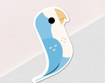 May include: A blue and white cartoon bird with a yellow beak and black eyes. The bird is facing right and has a white outline.