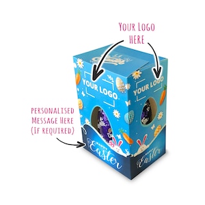 May include: A blue and white cardboard box with a window to display a chocolate Easter egg. The box has a design of Easter bunnies, carrots, and eggs. The text "Happy Easter" is printed on the box. The box is customizable with a logo and a personalized message.
