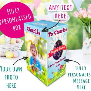 May include: A personalized Easter gift box featuring a child's photo and the text "Charlie". The box has a festive design with Easter eggs, butterflies, and the message "Happy Easter". It includes the text "Love from Nanny".