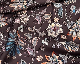 May include: A dark brown fabric with a floral pattern. The flowers are in shades of pink, orange, and blue. The fabric has a soft, silky texture.
