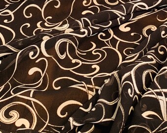 May include: Black sheer fabric with a white swirl pattern.