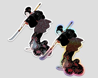 May include: Two colourful stickers featuring a woman in a black kimono holding a sword. The woman is in a dynamic pose, with her leg raised and her sword pointed forward. The stickers have a holographic finish, creating a rainbow effect.