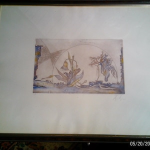 May include: A framed artwork featuring a delicate watercolor illustration of a drooping flower and abstract organic shapes in muted tones of blue, gold, and brown. The piece is set against a white mat within a dark brown frame with gold trim.