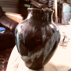 May include: A set of three ceramic mugs with a speckled, matte finish. The mugs are in shades of cream, light gray, and dark gray. Each mug has a simple, minimalist design, perfect for coffee or tea.