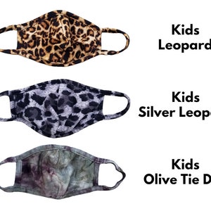 May include: Three kids' face masks. The first mask is leopard print. The second mask is silver leopard print. The third mask is olive tie dye. The text on the image reads "Kids Leopard", "Kids Silver Leopard", and "Kids Olive Tie Dye".